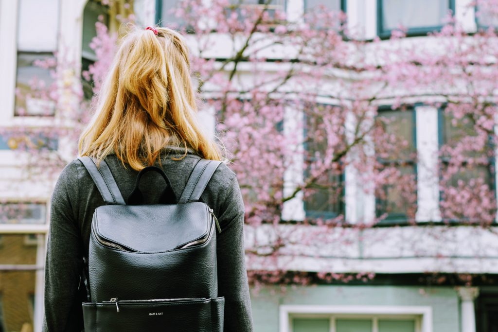 Picture of a woman with a backpack, embarking on free TAFE courses in Victoria