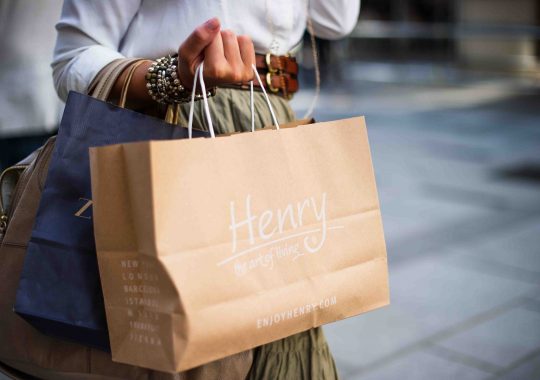 Woman holding bags from a spree at some of the best outlet shopping in Melbourne