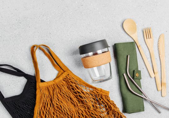 Picture of a reusable bag, coffee cup and reusable cutlery set