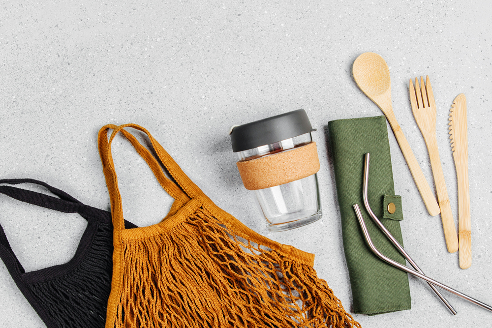 Picture of a reusable bag, coffee cup and reusable cutlery set