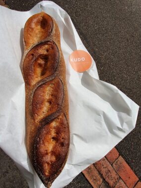 Picture of a baguette loaf of bread from gluten free bakery, Kudo Melbourne bakery