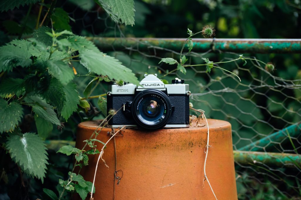 Picture of an analogue camera outside of a place for film developing in Melbourne