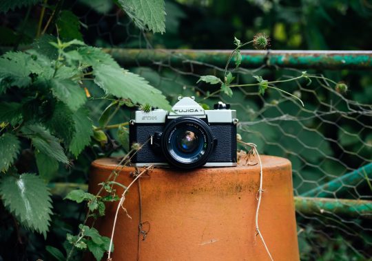 Picture of an analogue camera outside of a place for film developing in Melbourne