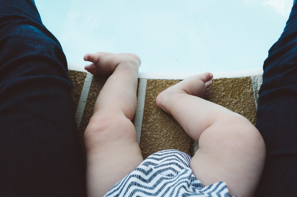 Picture of a baby at the edge of a pool, about to start baby sensory classes in Melbourne