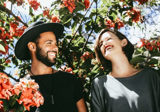 Picture of a couple laughing in a garden, enjoying a great Melbourne date idea