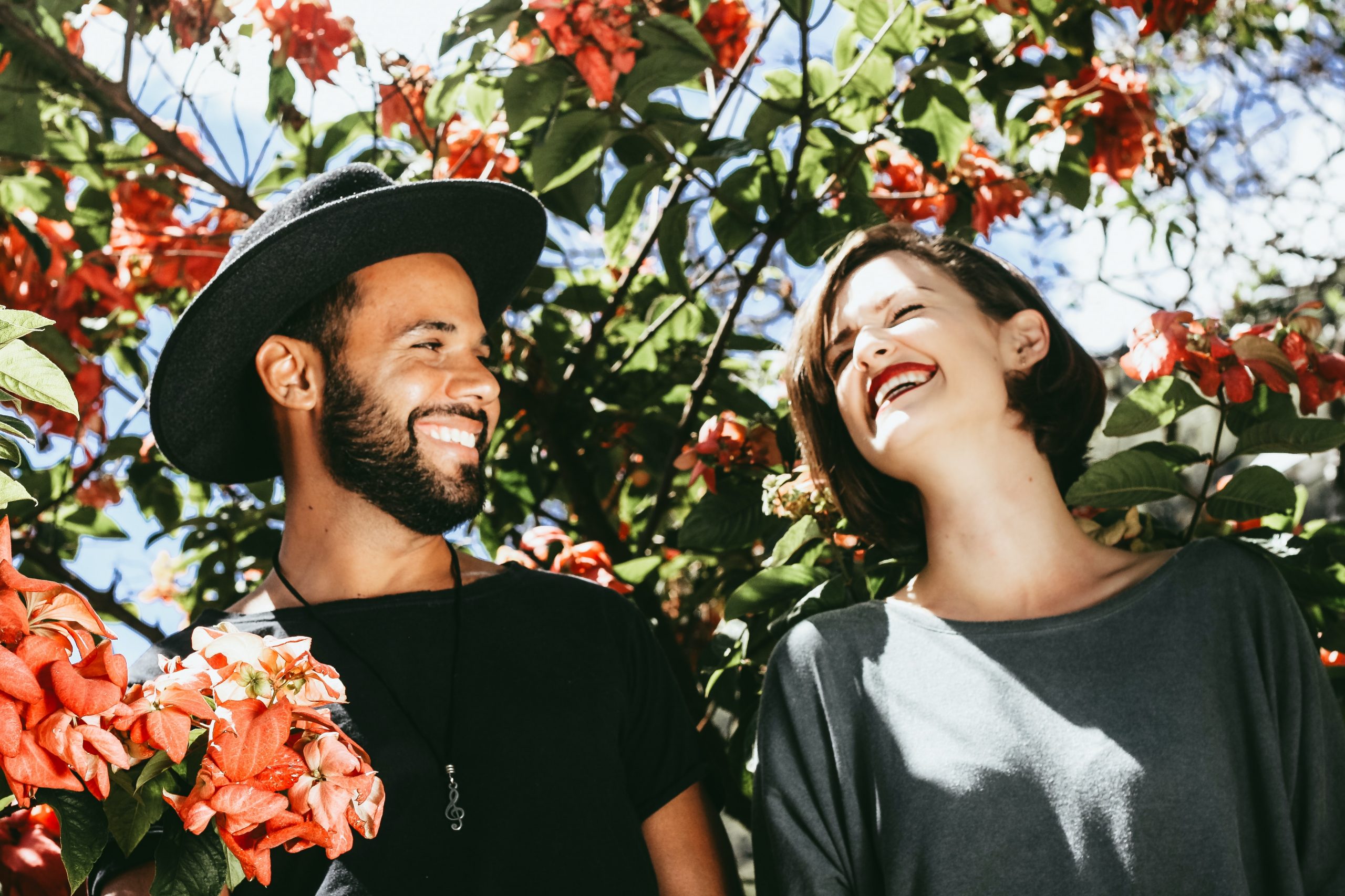 Picture of a couple laughing in a garden, enjoying a great Melbourne date idea