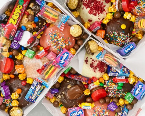 Picture of three lolly boxes stacked on top of each other, featuring lollies and chocolate