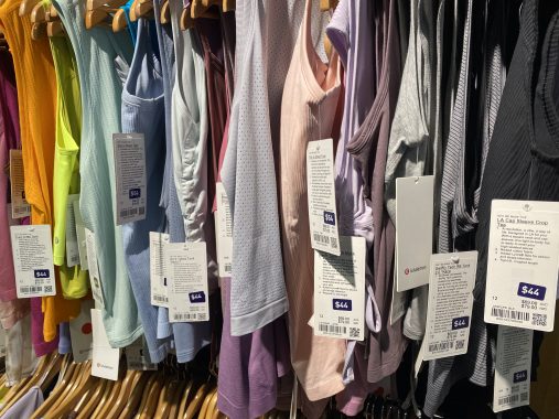 A rack of lululemon tops available at the lululemon outlet in Melbourne, each of them are different colours and priced at $44