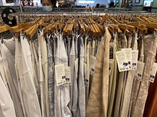 Picture of lululemon leggings on a rack, from a white to beige colour range