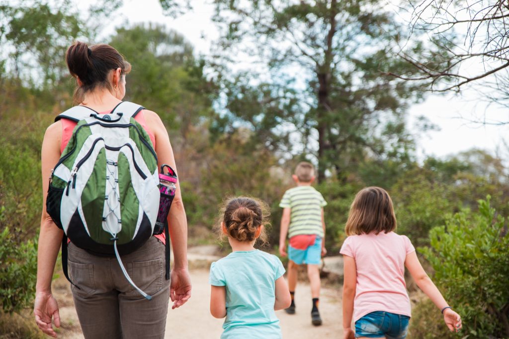 Picture of a mother and three children enjoying some outdoor activities in Melbourne with kids as they follow a trail