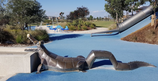 Photo of Saltwater Coast Crocodile Park, with a steel crocodile in a water park setting