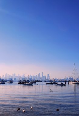 Picture of a fishing spot in Williamstown Beach in Victoria, with the Melbourne skyline visible in the distance