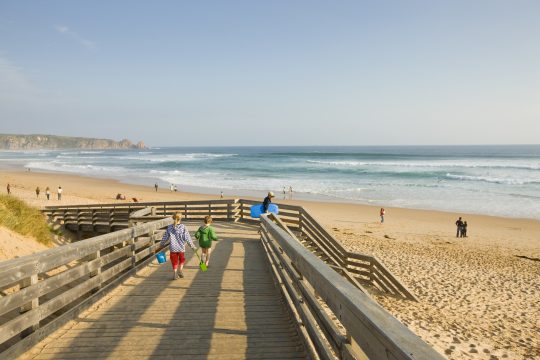 Picture of children walking down a wooden ramp to Cape Woolamai beach, making its way to the entrance to the walking tracks and Phillip Island accommodation