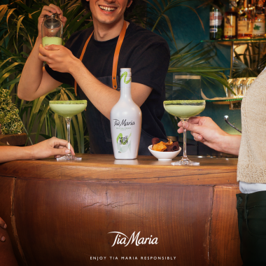 Picture of a Tia Maria Matcha Cream being shaken at the Nick & Nora bar, with two cocktail glasses full and a bottle of spirits in the middle