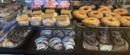 Picture of sweet bakery goods at Mister Nice Guy's Bakeshop, including doughnuts and cinnamon scrolls