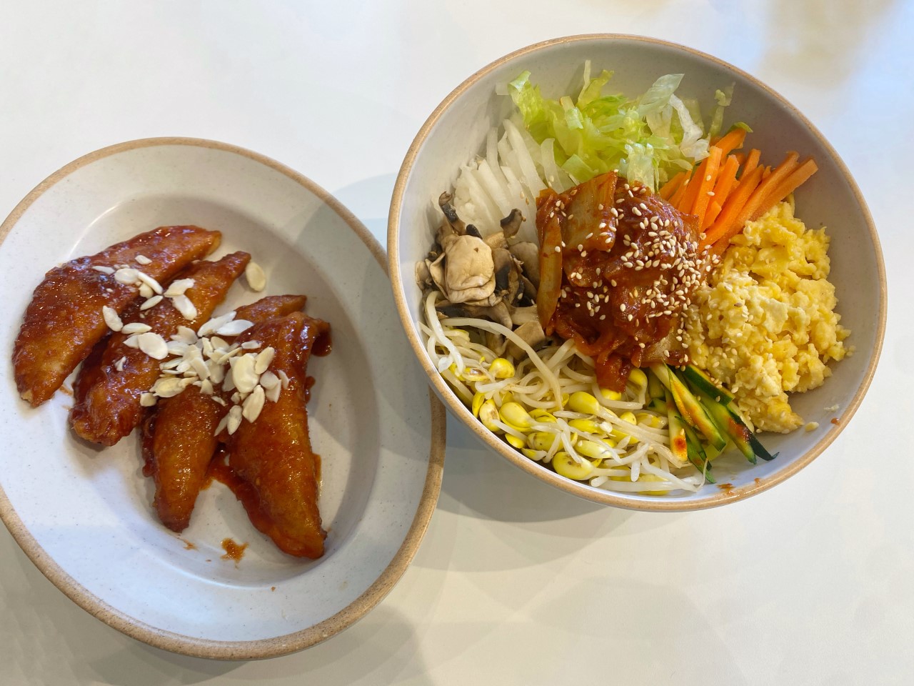 Picture of the vegan food at Paik Bibim. The left is fried dumplings and the right is a vegan bibimbap bowl