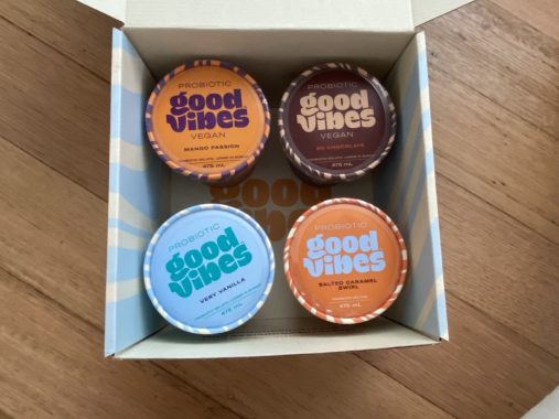 Picture of a cardboard box with four pints of Good Vibes vegan ice cream flavours