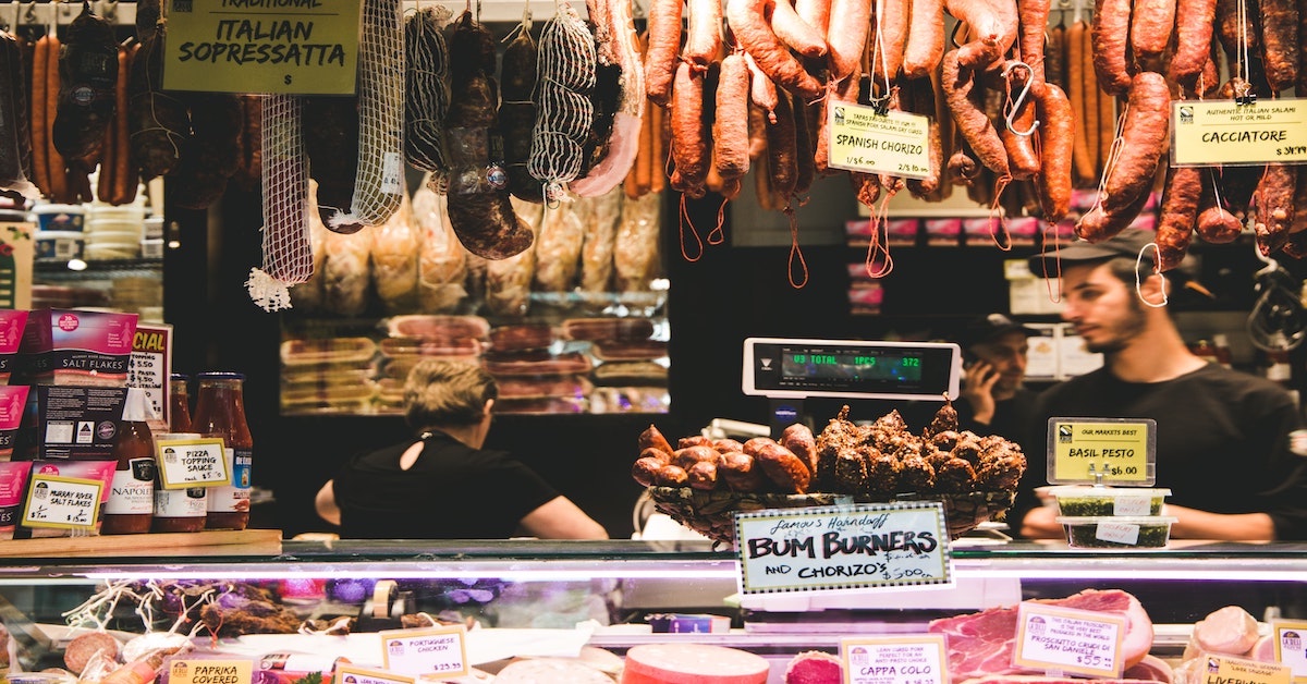 Picture of South Melbourne Market vendors with delicatessen items for sale