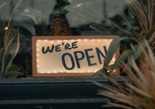 Picture of gift shop in Melbourne frontage with a sign that says 'We're open'