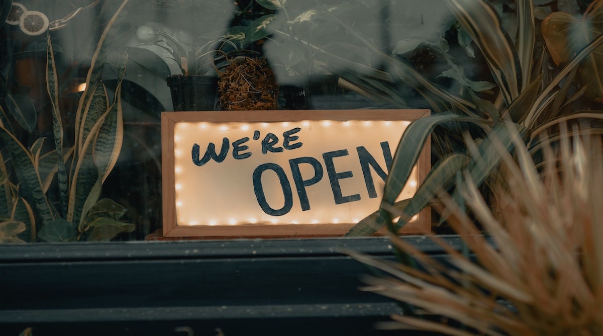 Picture of gift shop in Melbourne frontage with a sign that says 'We're open'