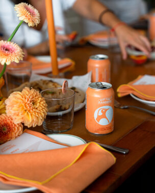 Picture of Part Time Rangers seltzer on a dining table with flowers