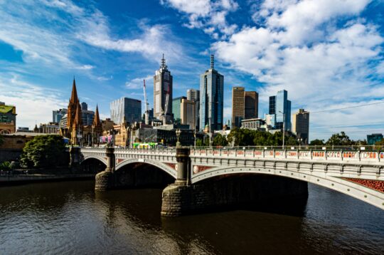 Picture of the Yarra River with the city skyline in the background showing a Mother's Day river ride