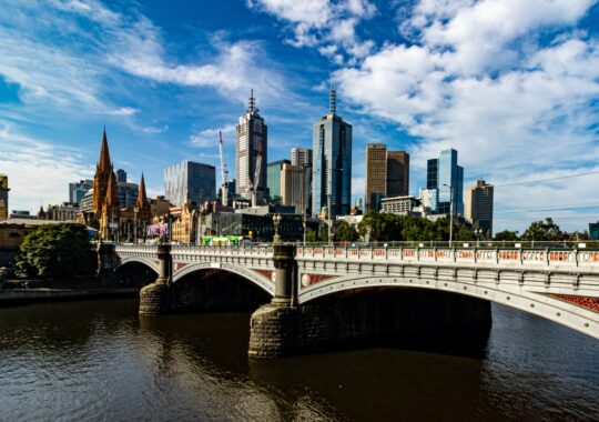 Picture of the Yarra River with the city skyline in the background showing a Mother's Day river ride