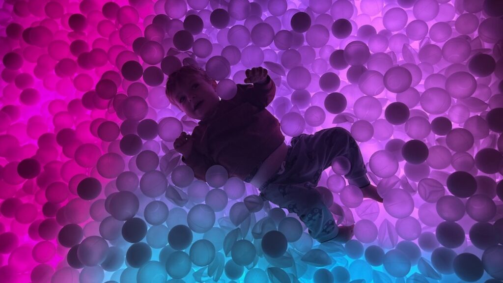 Chaos Lab Melbourne pictures showing a child playing in the coloured ball pit