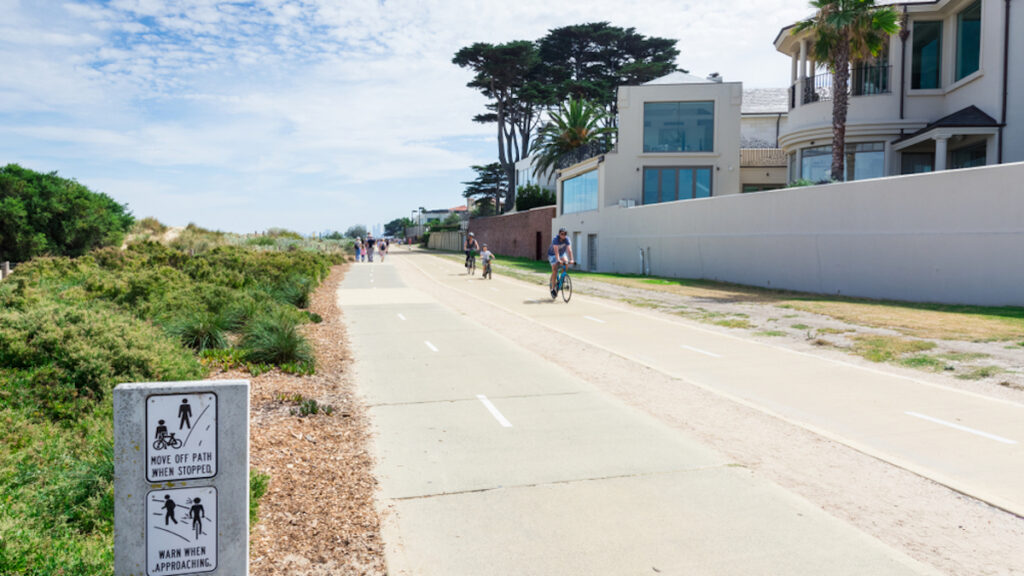 Picture of a group on family friendly bike trails in Melbourne, on the road with the sun in the sky