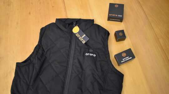 ORORO heated apparel vest and battery pack on a table