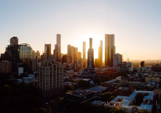 Picture of Melbourne city skyline with the sun setting in the background