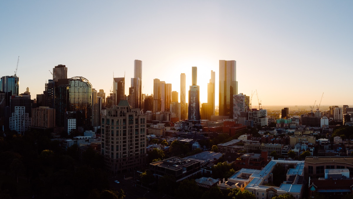 Picture of Melbourne city skyline with the sun setting in the background