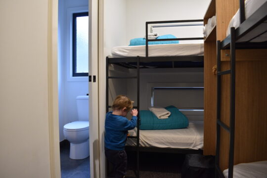 Toddler climbing bunk bed accommodation at BIG4 Yarra Valley Park Lane Holiday Park