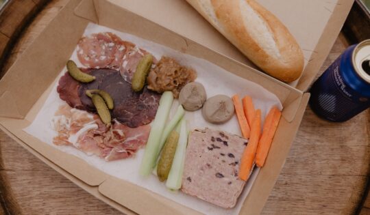 Plate of French food in a brown box at the So Frenchy, So Chic Melbourne festival at Werribee Mansion