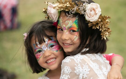 Two children enjoying the So Frenchy, So Chic Melbourne festival at Werribee Mansion