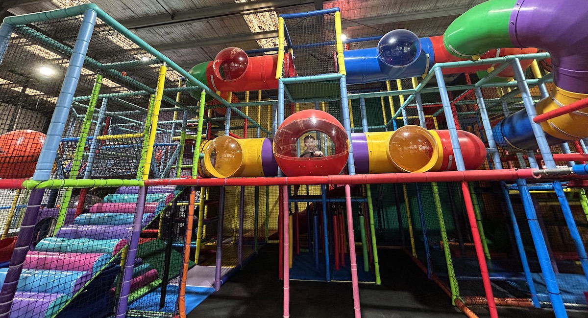 Picture of a child playing on play equipment at play centres in Melbourne