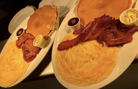 Picture of pancakes, bacon and scrambled eggs on a plate at Walrus Brunswick