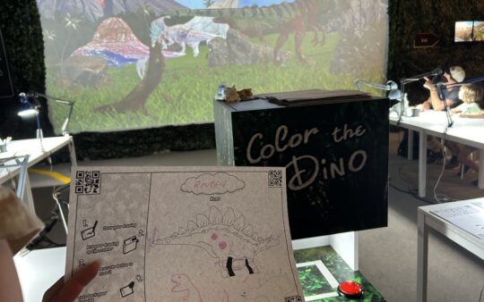 A colouring-in page completed at Dinos Alive Melbourne, which is projected onto a large screen through an immersive activity