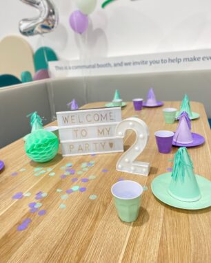 picture of a party set up on a table with party hats, plates and balloons at Eden Play Mill Park