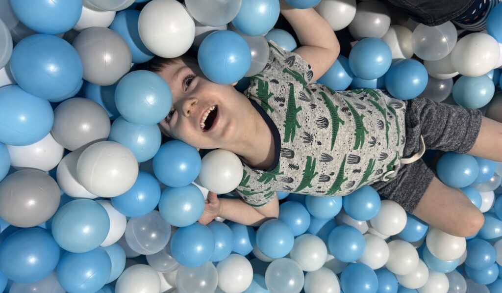Picture of a boy in a ball pit in Landing Playcentre
