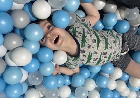 Picture of a boy in a ball pit in Landing Playcentre