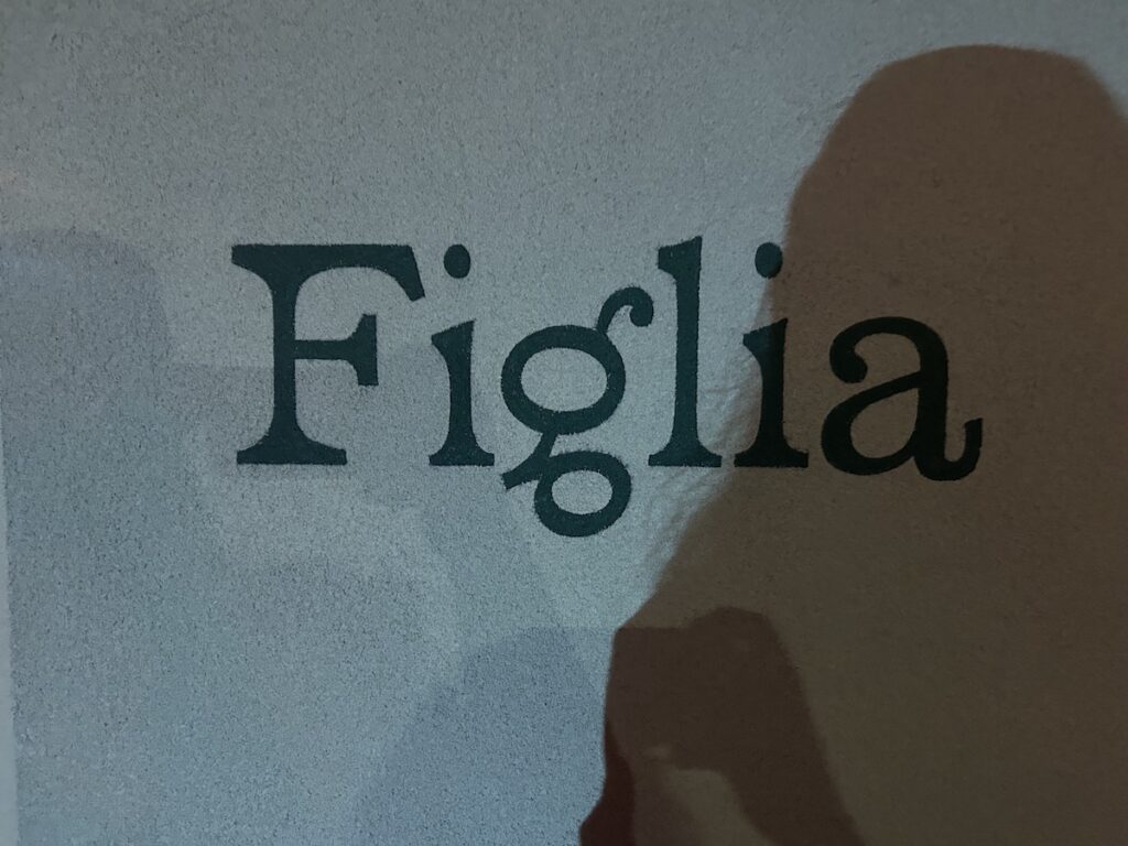 Figlia Brunswick East restaurant sign with shadows cast over the sign